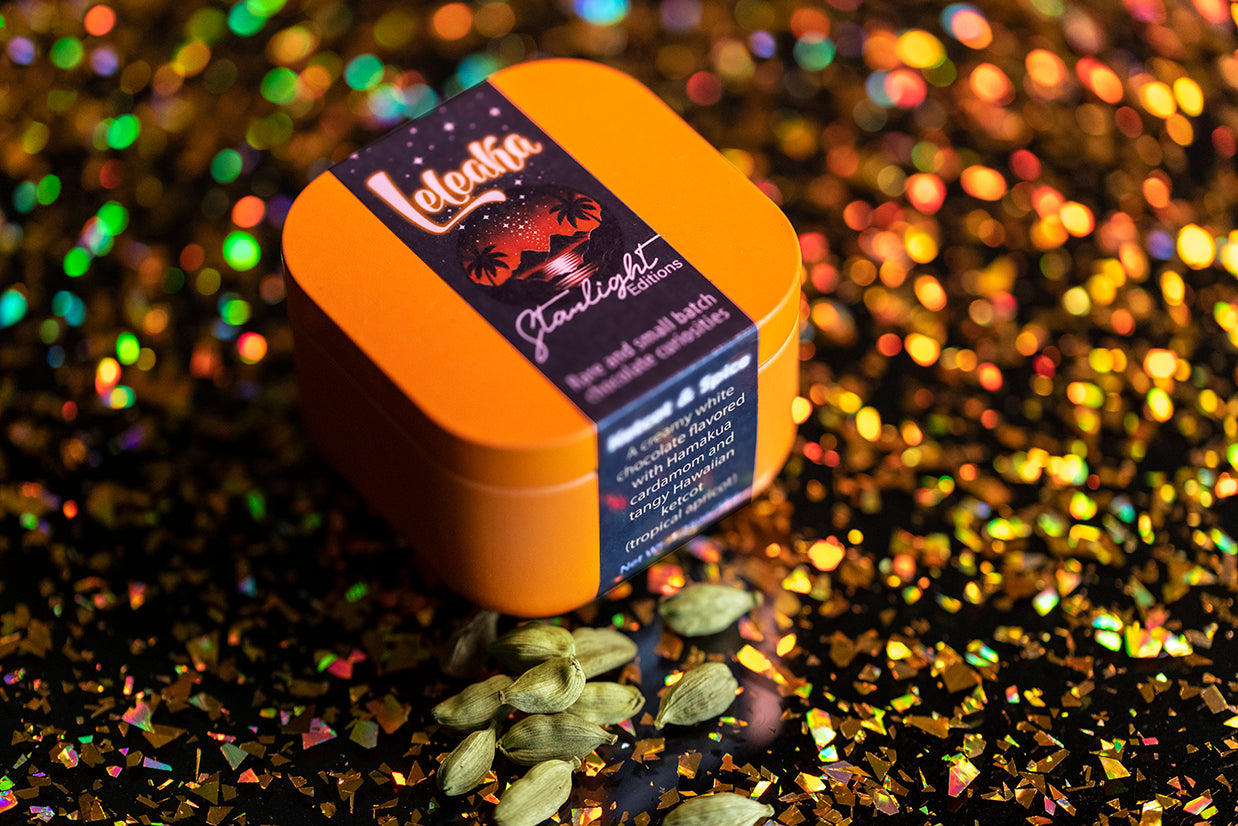 Orange Starlight Editions tin on a glittery background