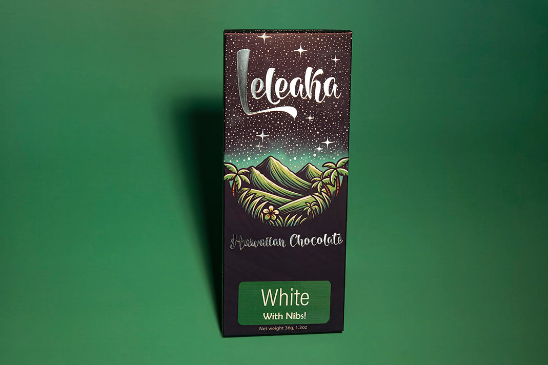 Leleaka butter white bar (with nibs) packaging on green background